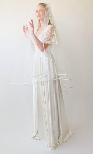 https://blushfashion.boutique/cdn/shop/files/blushfashion-bridal-ivory-tulle-veil-minimalist-style-soft-wedding-veil-with-a-satin-finish-4072-31713022378099.jpg?v=1701687530&width=320